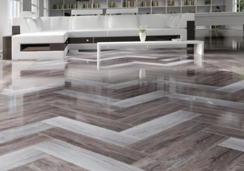 Modern flooring installation with herringbone pattern completed by Padilha Remodeling in Deerfield Beach Florida